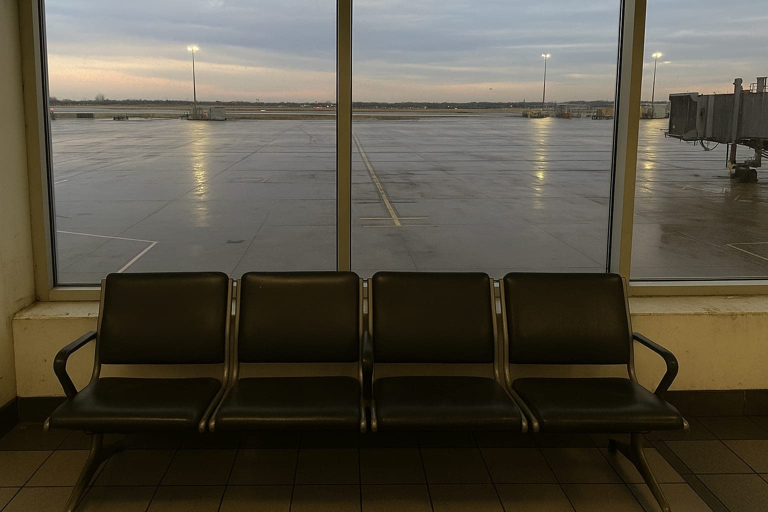 An airport window at dusk, the trips sold through a flight booking website you create yourself